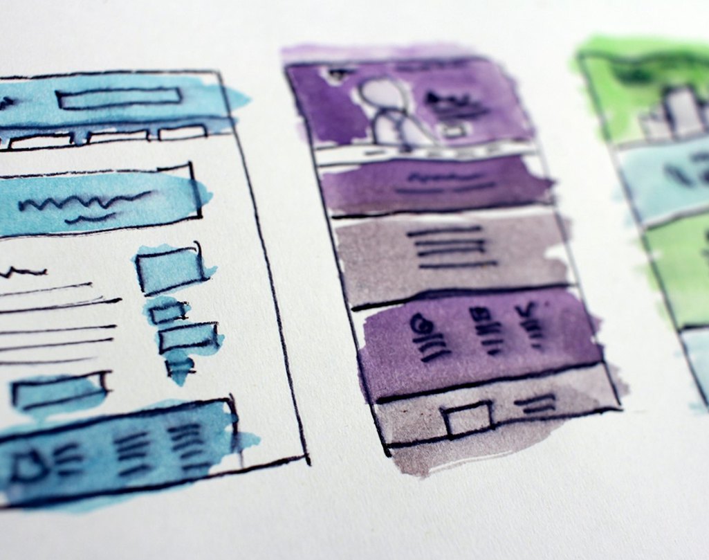 Hand-drawn wireframe sketches of website layouts