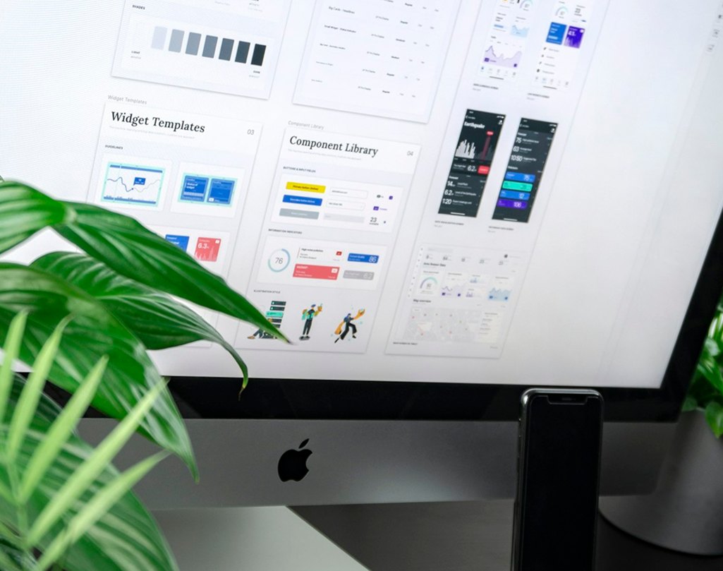 Monitor displaying a design system interface on a desk