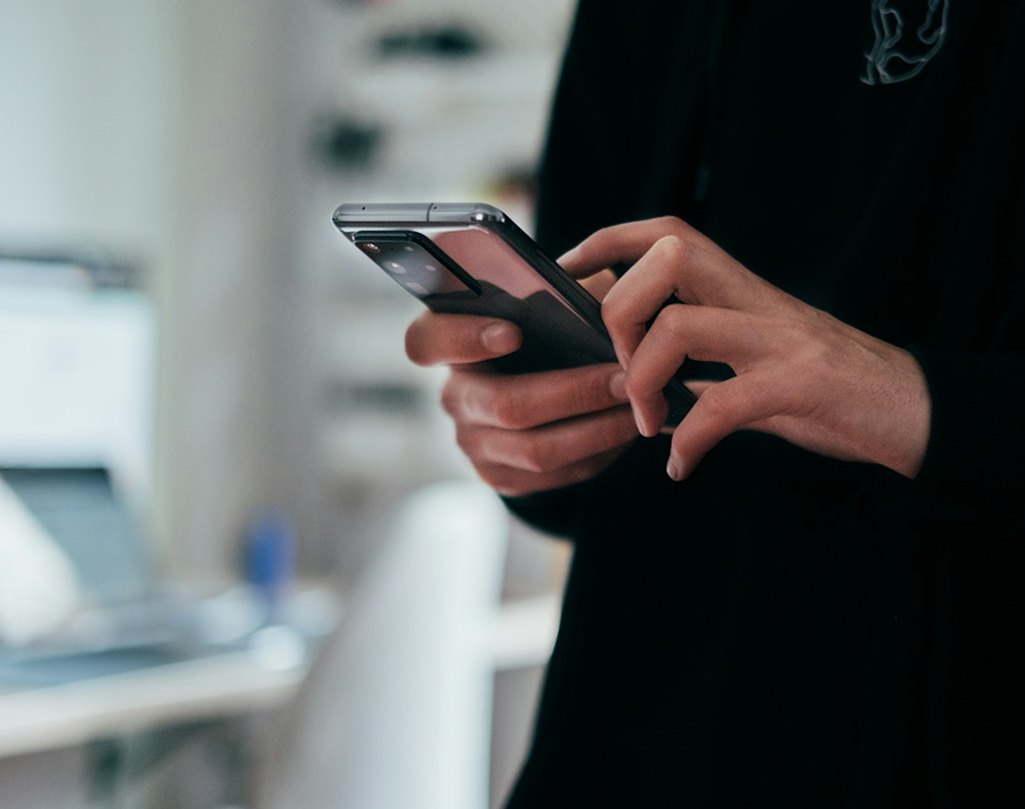 Person testing an app on a smartphone
